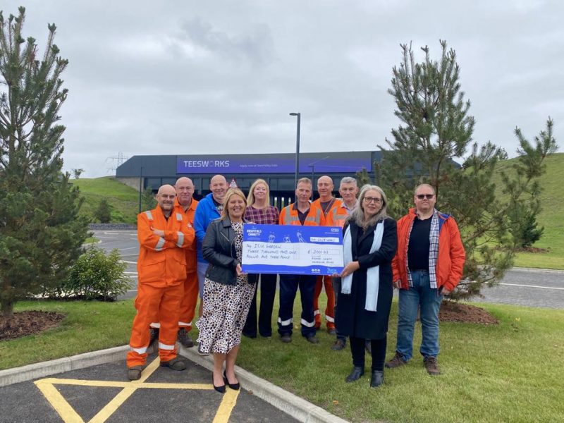 Staff at the Teesworks site presenting a cheque to Our Hospitals Charity.