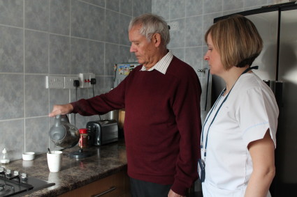 Patients makes cup of tea with therapist