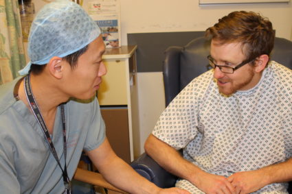 Anaesthetist explaining procedure to patient.