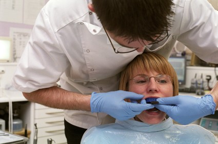 Orthodontist treating patient