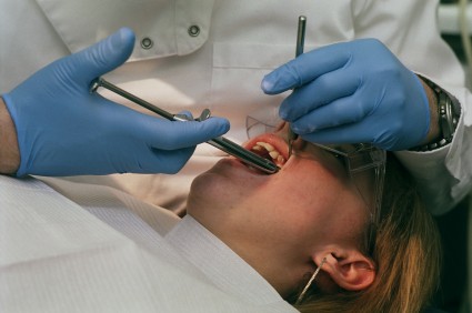 Orthodontist checking teeth