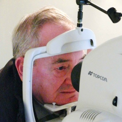 Patient having eye screening test