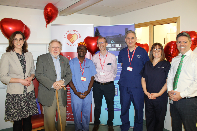 Staff and charities celebrating meeting charity target