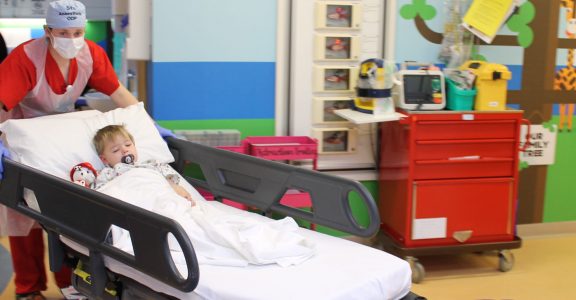 Young patient in trolley gong to theatre