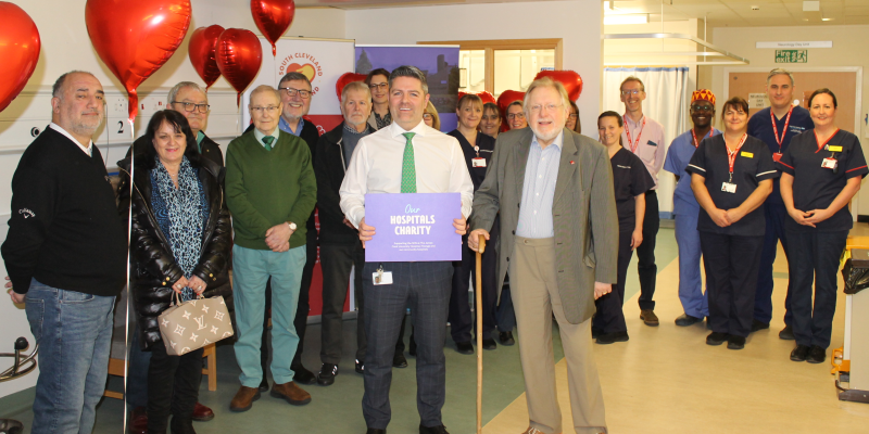 Staff in hospital celebrating hitting a charity target