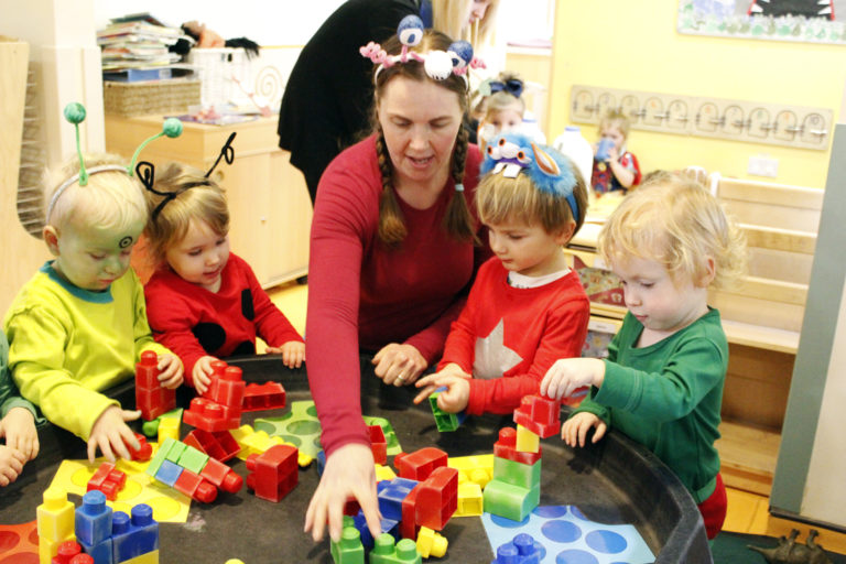 Children playing with building blocks at Playdays Day Nursery
