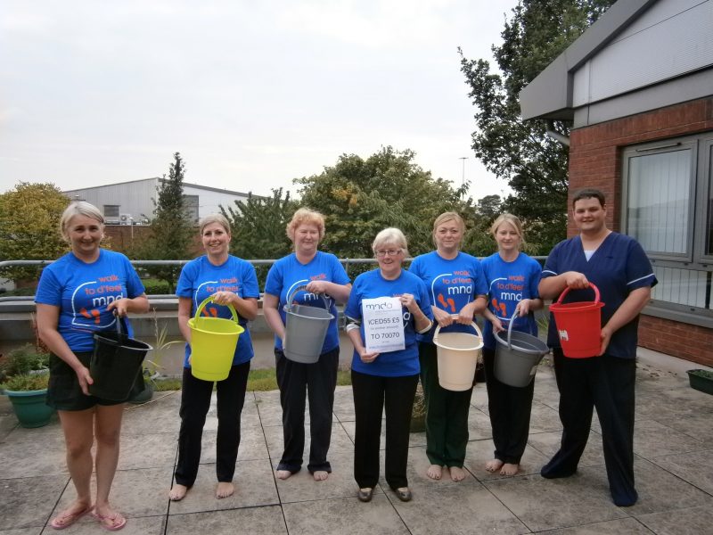 Fundraising team with buckets