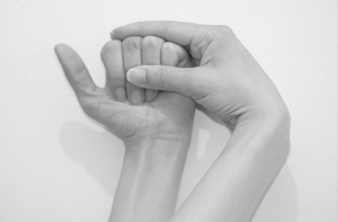 Using the other hand to bend your finger towards the palm, in a fist like position