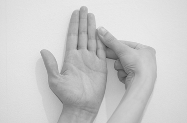 Use the other hand to stretch you rfinger straight, supporting the back of the hand