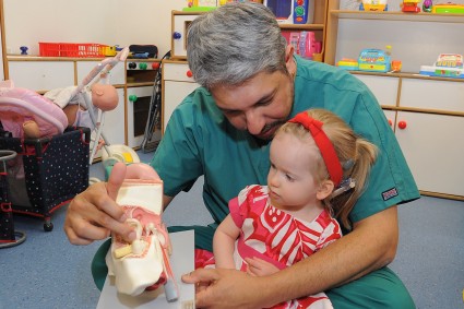 Megan and Dr Banerjee looking at a model ear on the children's ward at James Cook