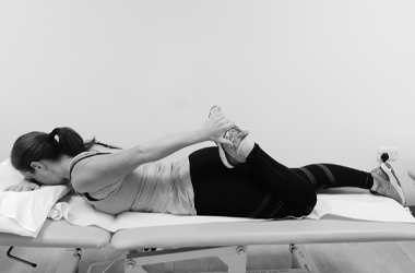 Quadriceps exercise, laid face down bending one knee - hold the ankle and pulling the foot towards your buttocks