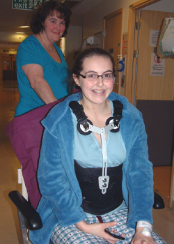 Ciaran in a wheelchair with her mum pushing her