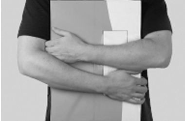 Hold the larger objects against your body with your arm around it