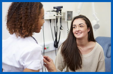 Image of a teenager talking to a health professional