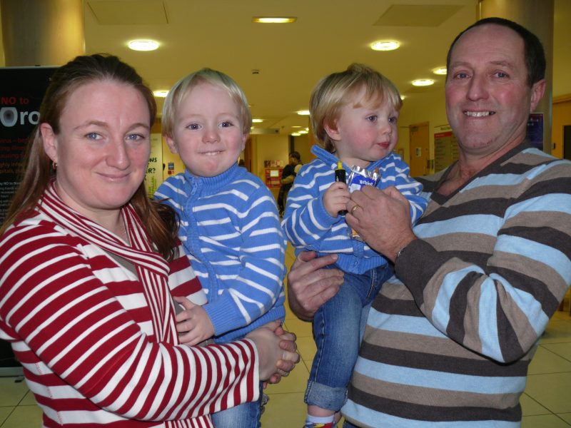 Paul and Joanne Adams holding Matthew and Daniel