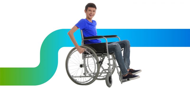 Young teen in a wheelchair smiling