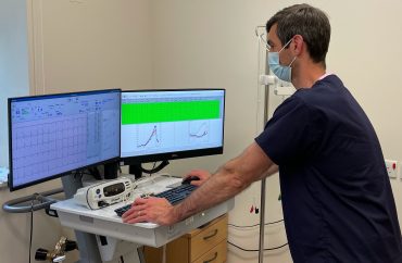 Clinical scientist reading ECG and respiratory measurements