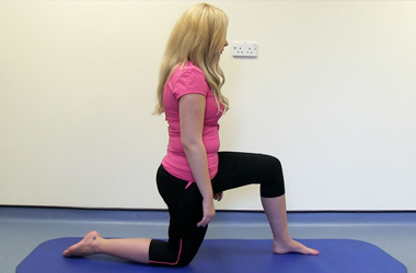 Kneeling on the affected leg in a lunge position