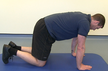 In crawling position - hands directly under the shoulders