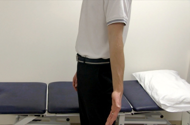 Arm straightened at the elbow as far as possible