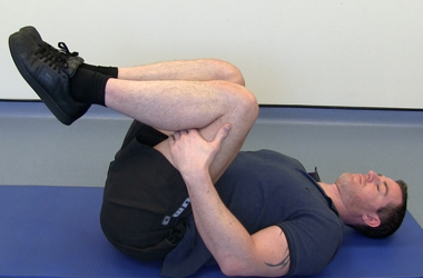 Both hands are placed on both legs to encourage the stretch