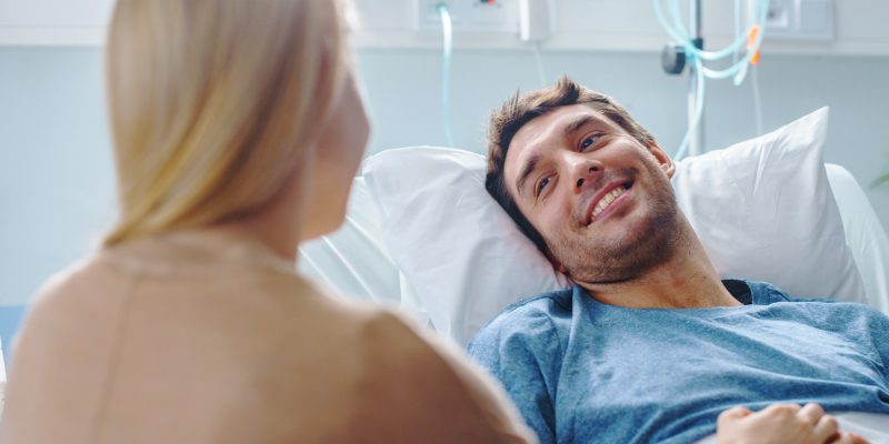 A wife visiting her husband in the hospital