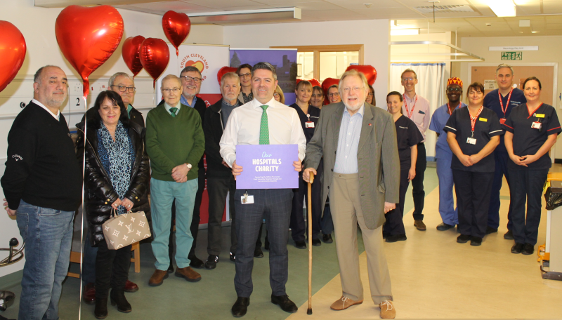 Staff in hospital celebrating hitting a charity target