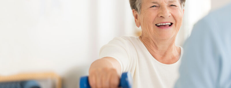 Woman doing exercises with a member of the physiotherapy team