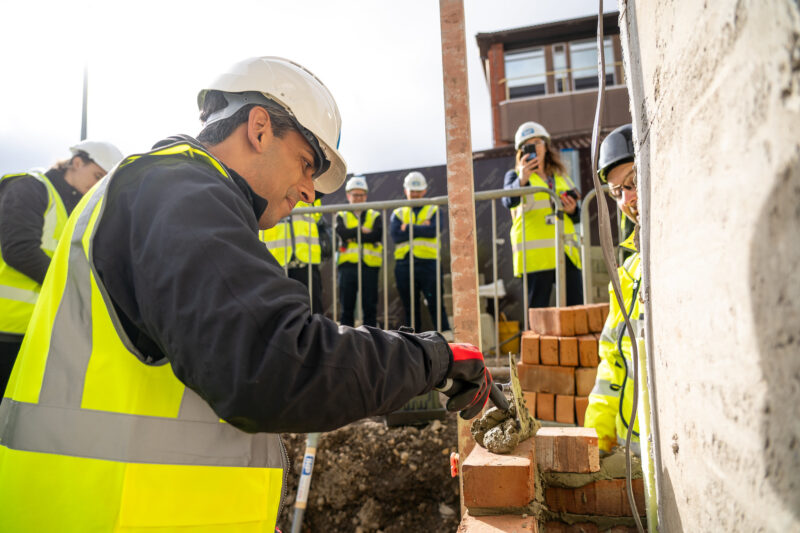 MP Rishi Sunak lays one of the first bricks