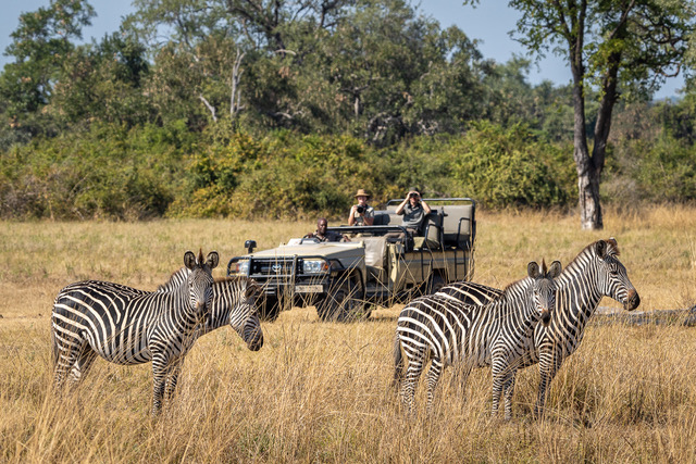 Ginny and Keith jeep safari watching zebra