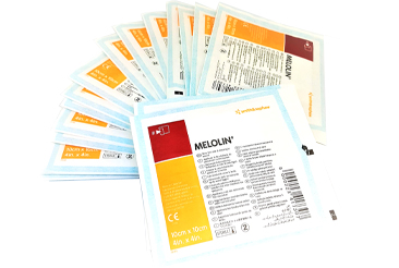 Low adherent sterile dressing pads