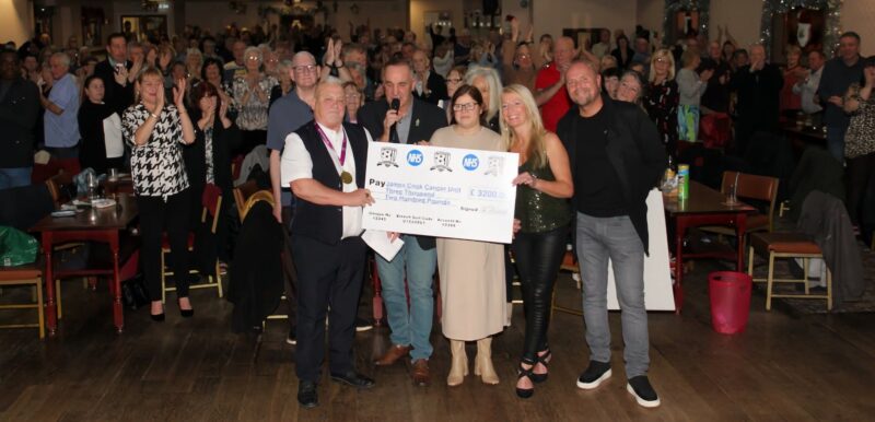 Social club members with giant cheque