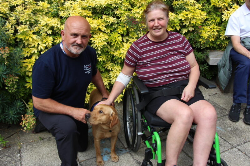 Elizabeth Donlan with Kyro and the dog handler