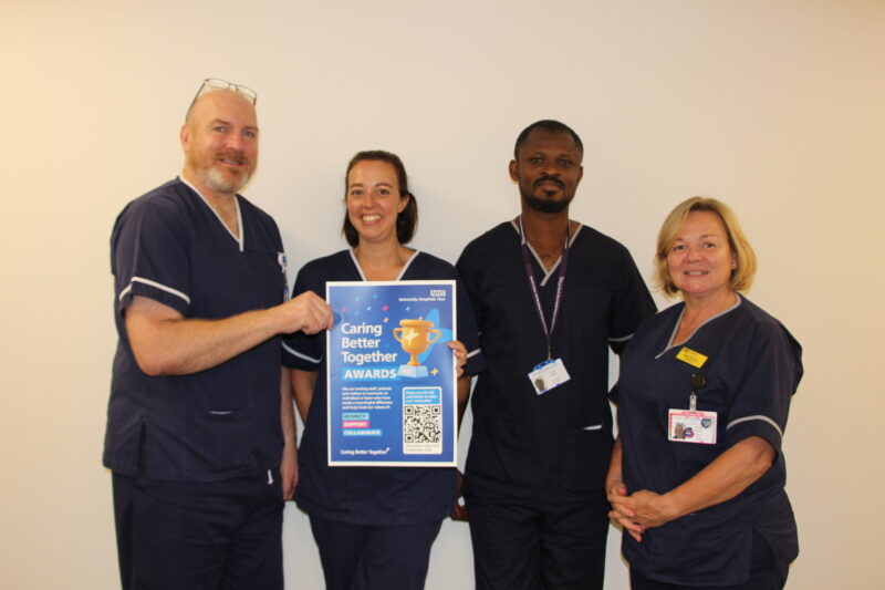Four members of the infection, prevention and control team holding the CBT awards poster