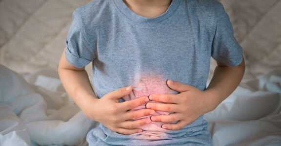 Person holding their stomach
