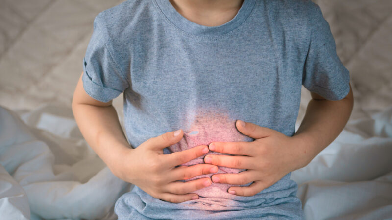 Person holding their stomach