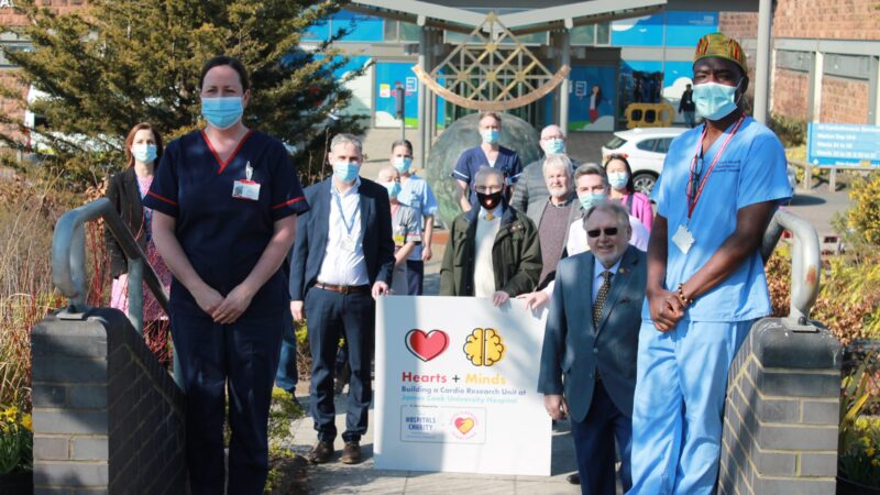 Clinical staff outside hospital entrance