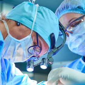 Close up of surgeons in operating theatre