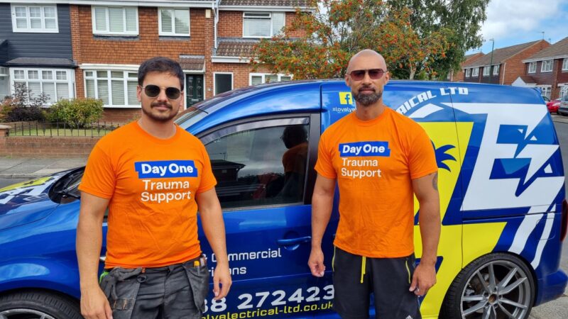 Cory and Mark wearing Day One t-shirts