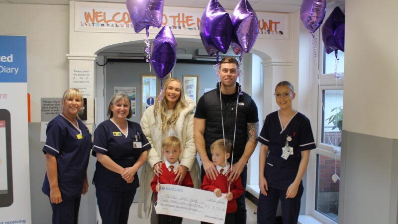 The-Adams-handing-over-the-cheque