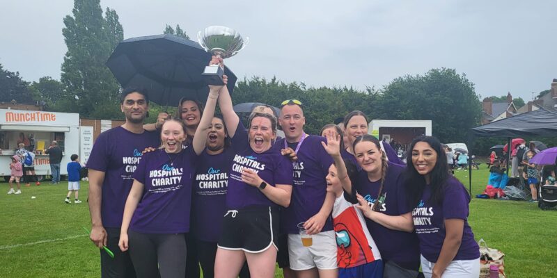 Staff celebrating at the family fun day