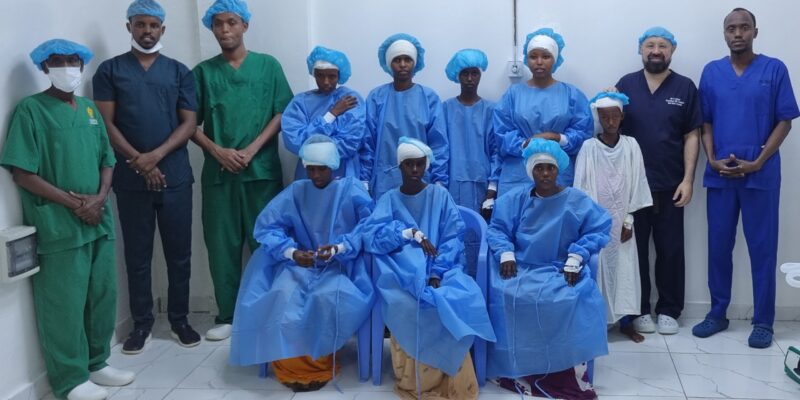 Mr Ahmad with patients and medical team in Somalia 2024