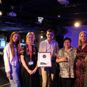 Group of people receiving an award