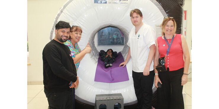 Mahwa Mohammadi,6, with her dad and staff from James Cook Hospital