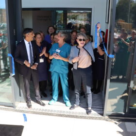 MP Rishi Sunak, 80-year-old scrub nurse Anne Lamb and Public health and prevention minister Ashley Dalton cutting the ribbon for the purpose-built facility