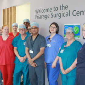 Dr Ashish Gulve and the team celebrating after operating on the 100th patient at the Friarage Hospital