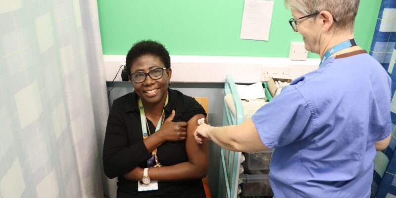 Esther Mireku, public health consultant, having a flu vaccine