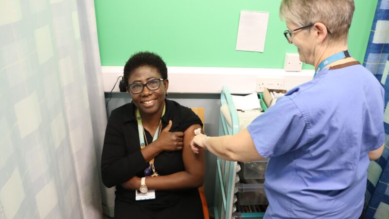 Esther Mireku, public health consultant, having a flu vaccine