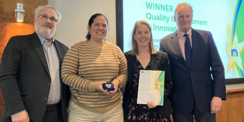 Stacey Stockdale and Rosibel Quintana receiving their award at the Northern Cancer Alliance conference