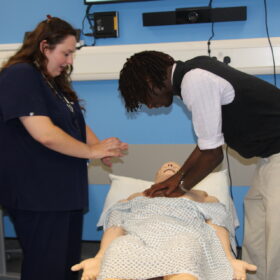 A student takes part in CPR training